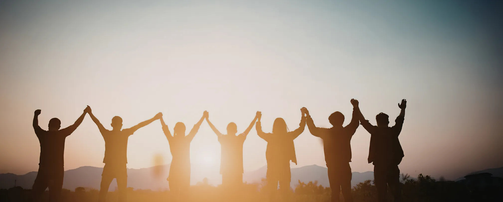 people holding hands against the sunrise in show of solidarity reposted by Made for Freedom 