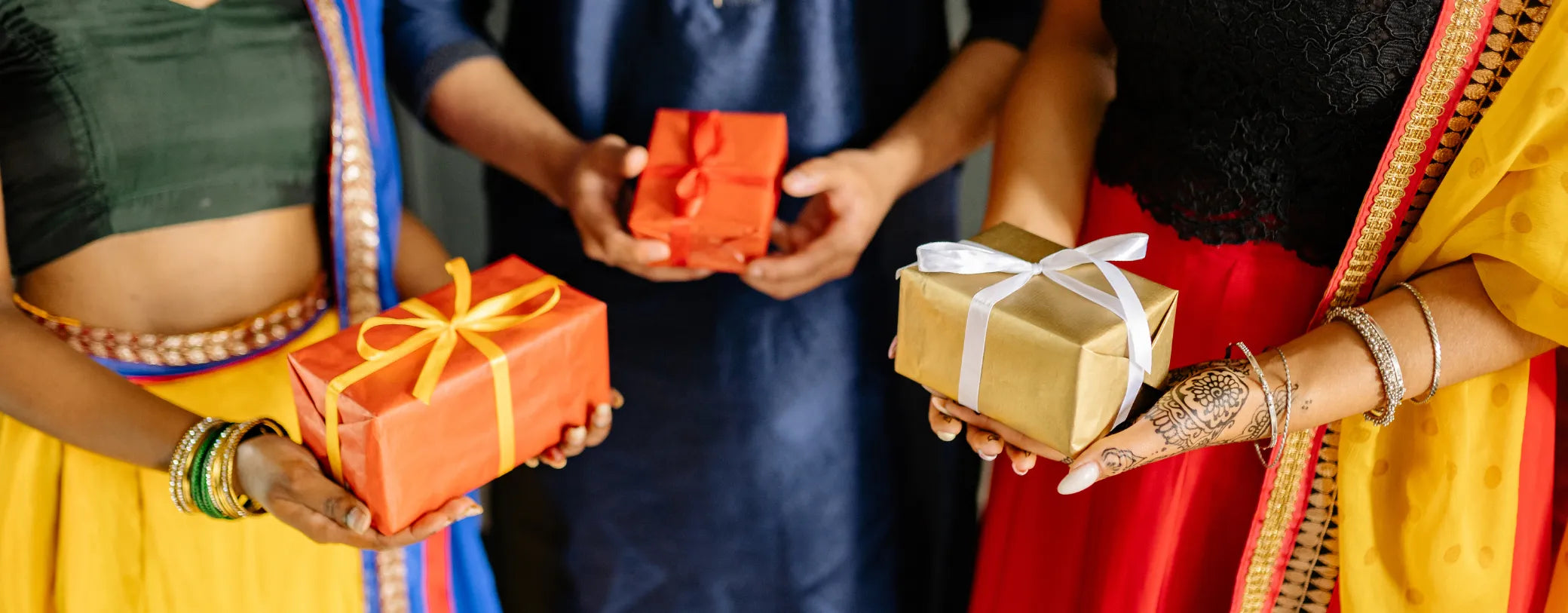women of color carrying beautifully wrapped gift boxes reposted by Made for Freedom