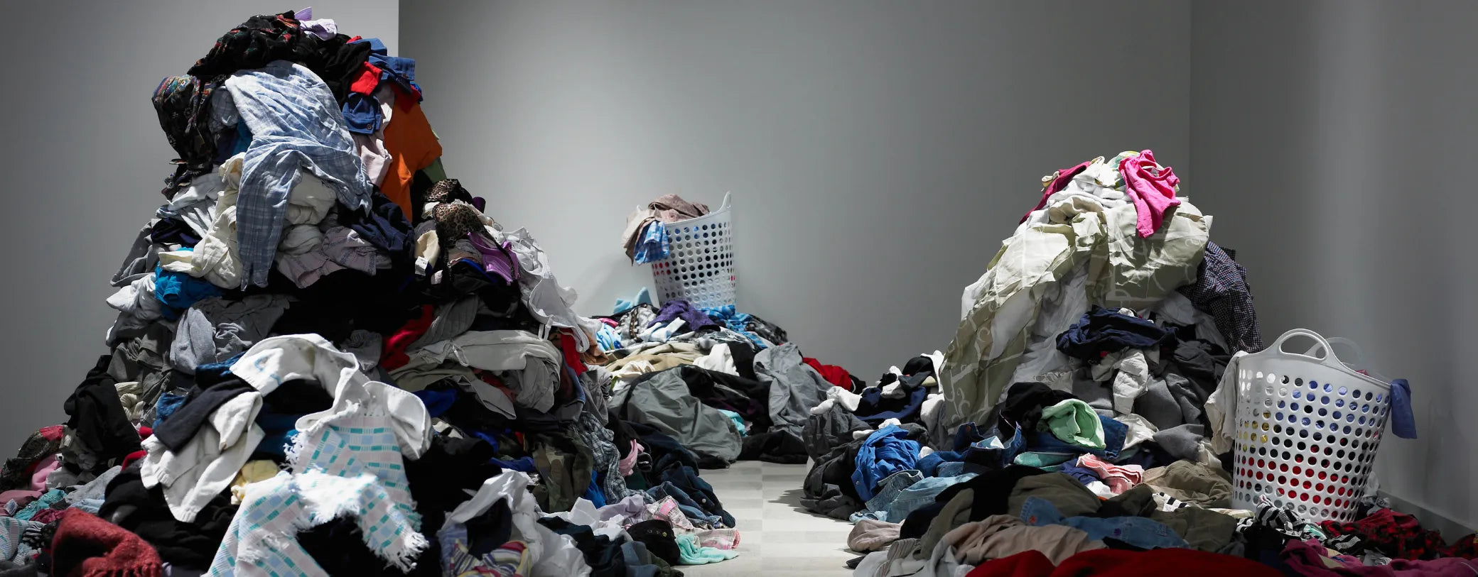 three piles of clothes in front of a white background reposted by Made for Freedom