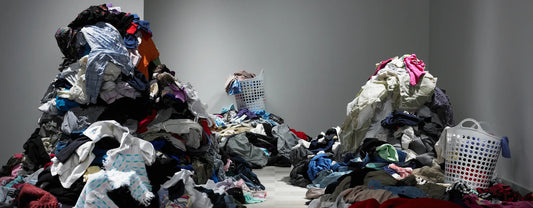 three piles of clothes in front of a white background reposted by Made for Freedom