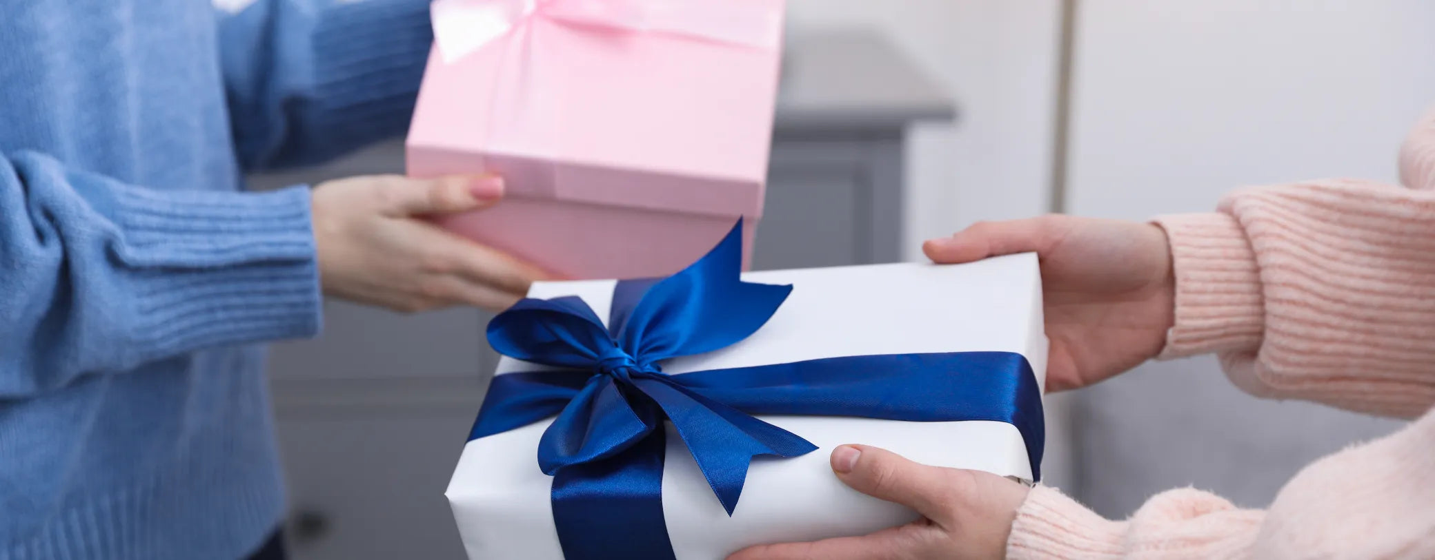 people in the office exchanging gift boxes with one another reposted by Made for Freedom