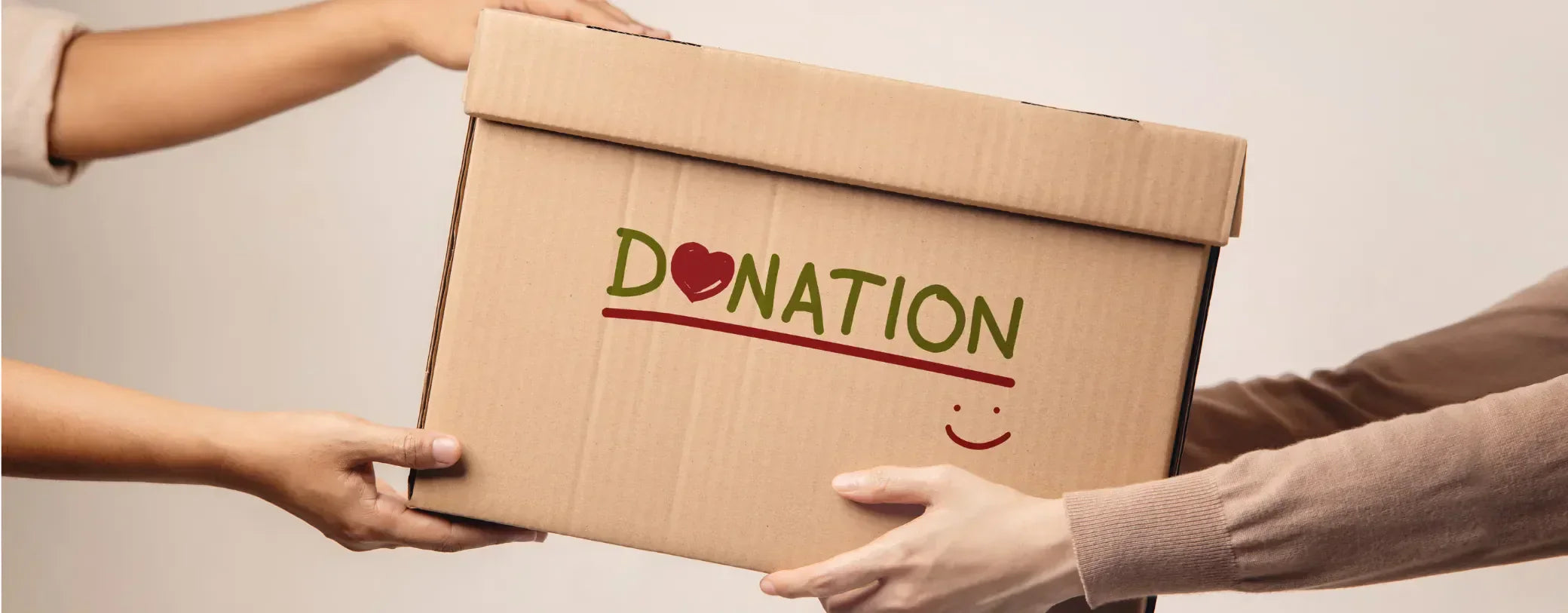 a donation box being handed over from one pair of arms to another reposted by Made for Freedom