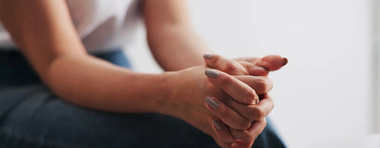 a woman with her hands clasped together while sitting down reposted by Made for Freedom
