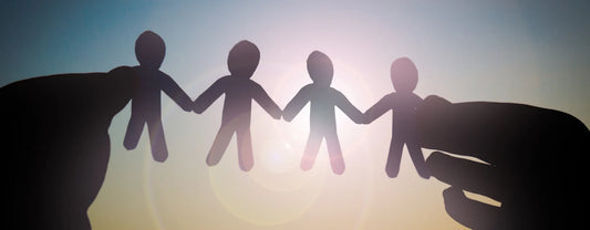 silhouette of hands holding paper cutouts shaped like people reposted by Made for Freedom