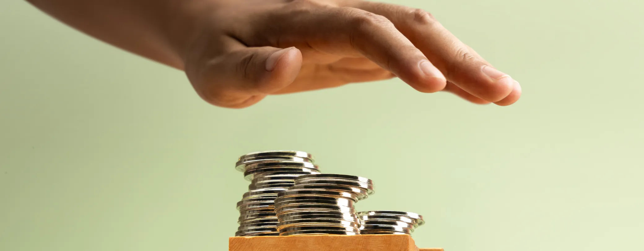hand about to grab a pile of change reposted by Made for Freedom