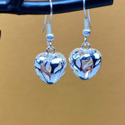 Devoted love  silver dangling heart earrings